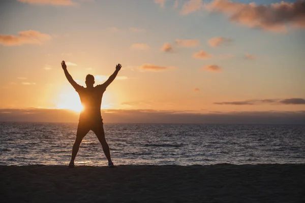 jumping jacks on the beach